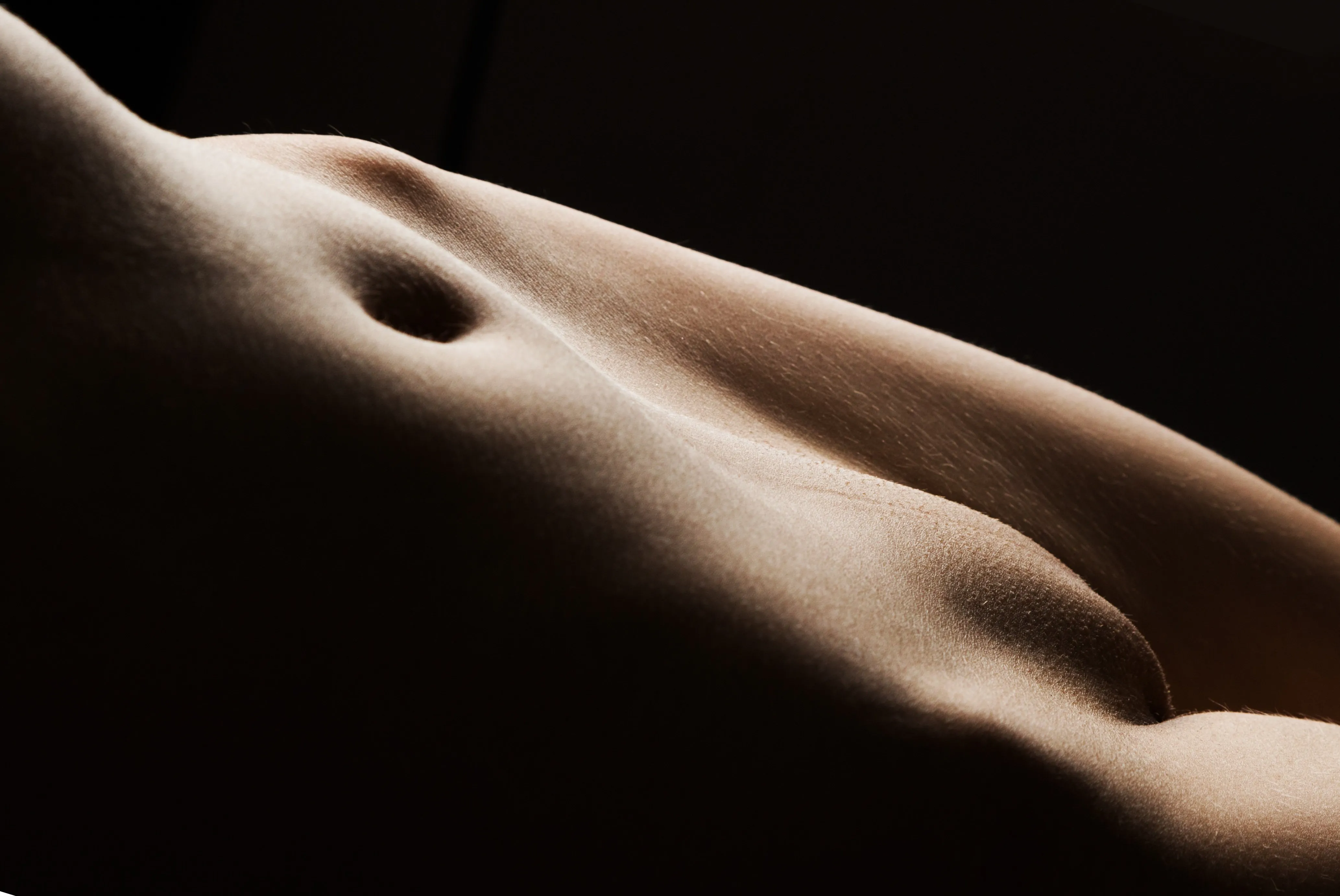 A naked woman's stomach.